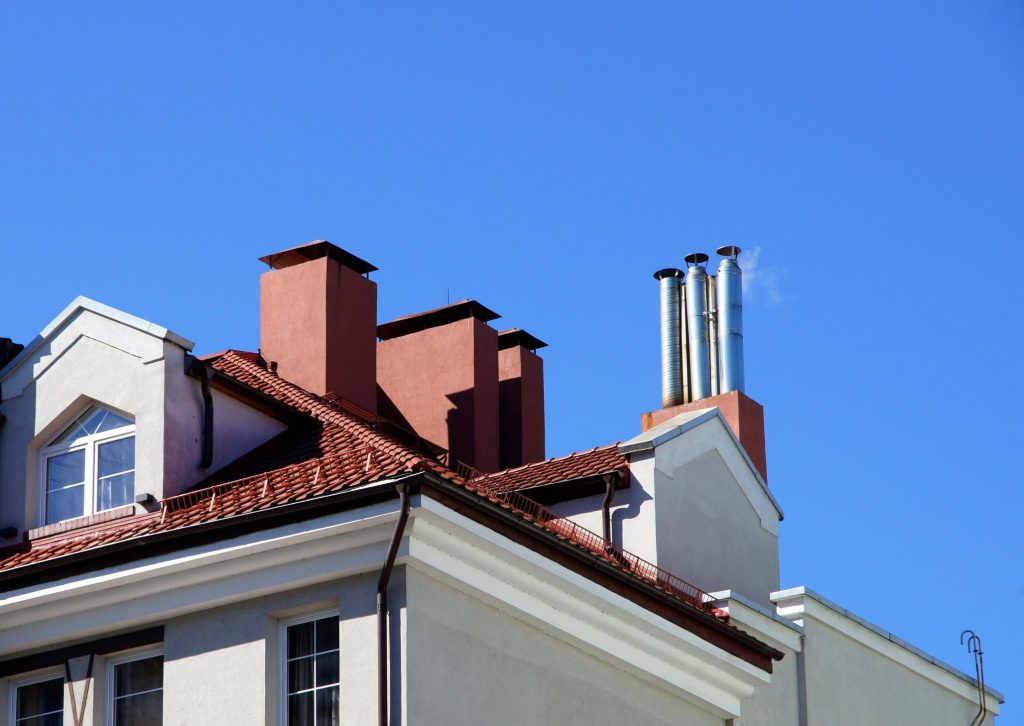 smoking chimney above the house